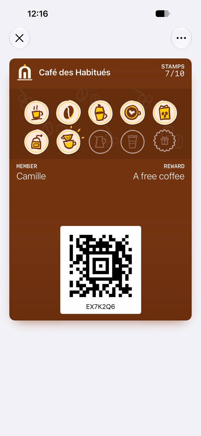 Sample loyalty card from Café des Habitués in Apple Wallet: 7 of 10 stamps, reward: A free coffee.